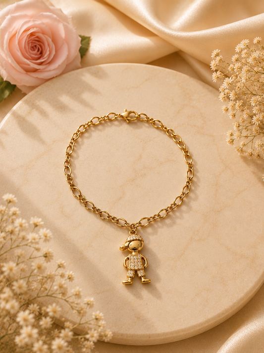 Pulseras de acero con baño de oro con dijes de niño o niña